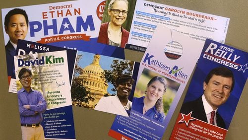 Campaign materials for 7th Congressional District Democratic candidates Carolyn Bourdeaux, Melissa Davis, Kathleen Allen, Ethan Pham, David Kim and Steve Reilly. Curtis Compton/ccompton@ajc.com