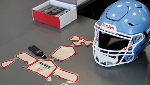 The Riddell impact response system which includes the alert monitor, in box above, and sensor pads used in the Riddell Speedflex Precision fit helmets is seen at the Riddell headquarters on Thursday, Oct. 5, 2017 in Des Plaines, Ill. Riddell is racing to develop a safer football helmet in light of growing concerns over concussions and CTE. (Jose M. Osorio/Chicago Tribune/TNS)