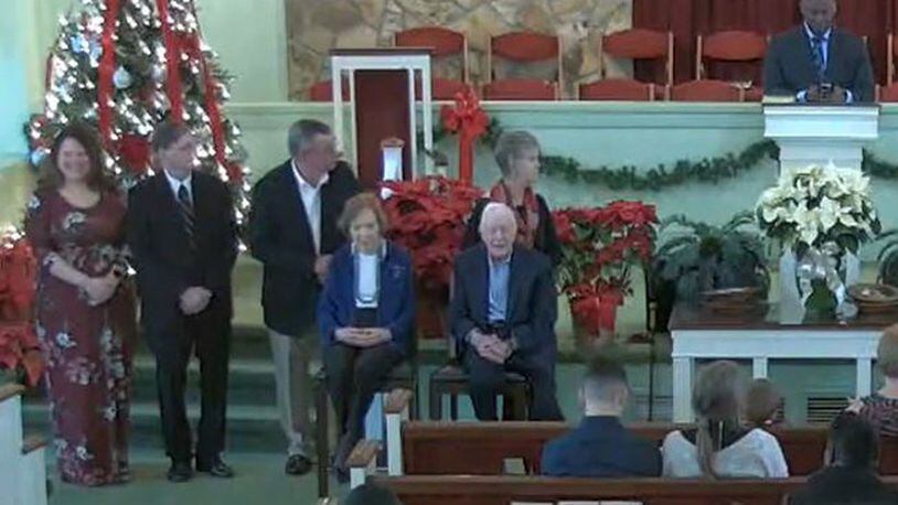 Former President Jimmy Carter and first lady Rosalynn Carter are seated at left in front of the congregation for a moment during the morning service at Maranatha Baptist Church in Plains on Sunday, December 29, 2019. (Photo from Maranatha Baptist livestream)