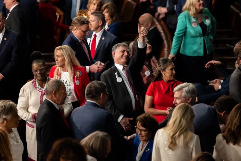 U.S. Reps. Marjorie Taylor Green, R-Rome (second from left), and Andrew Clyde, R-Athens, are seen inside the House of Representatives ahead of the State of The Union in Washington, DC on March 7th, 2024. (Nathan Posner for the AJC)
