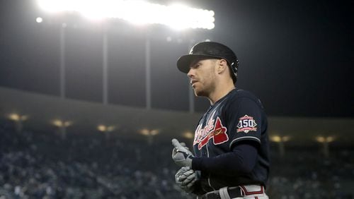 Braves first baseman Freddie Freeman walks off of the field after grounding out during the ninth inning. Curtis Compton / curtis.compton@ajc.com