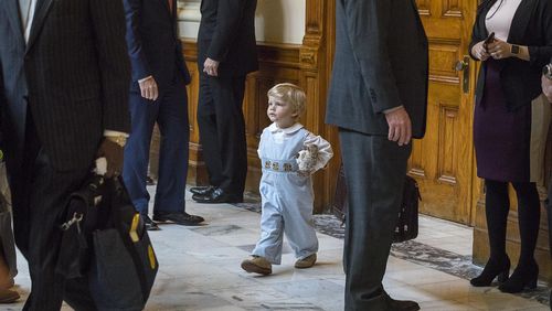 Two-year-old James Gambill of Cartersville navigates his way through Georgia lawmakers as he waits for his father, Rep. Matthew Gambill, to be sworn in.