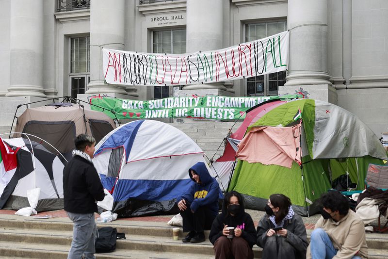 Dozens of tents are set up on the steps of Sproul Hall at UC Berkeley in Berkeley, Calif., Tuesday, April 23, 2024 as students and others establish an encampment in protest, demanding for a divestment in UC Berkeley's holdings with companies doing business with Israel. (Jessica Christian/San Francisco Chronicle via AP)