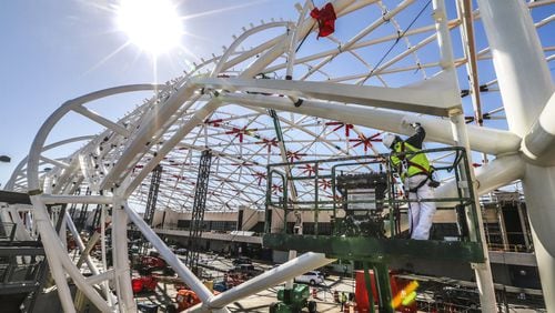 Construction work earlier this year on the canopy on the North side of Hartsfield-Jackson’s domestic terminal. JOHN SPINK/JSPINK@AJC.COM