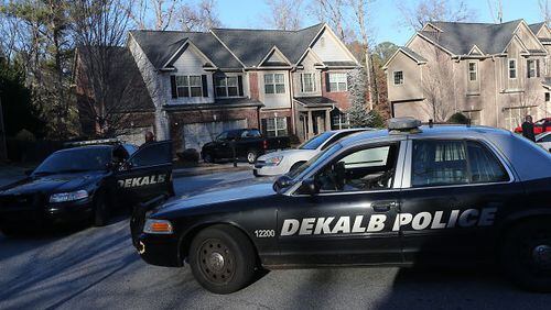 DeKalb police at the scene of a shooting that occurred after a home was broken into on Monday, Dec. 16, 2013.