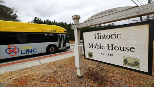 021722 Mableton: A CobbLinc bus passes by the historic Mable House on Floyd Road on Thursday, Feb. 17, 2022, in Mableton.   “Curtis Compton / Curtis.Compton@ajc.com”`