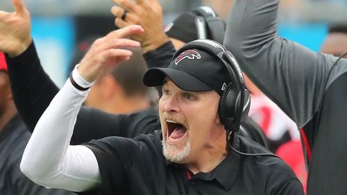 Falcons head coach Dan Quinn runs his defense from the sidelines in the final minutes of a 20-17 loss to the Panthers in a NFL football game on Sunday, November 5, 2017, in Charlotte.    Curtis Compton/ccompton@ajc.com