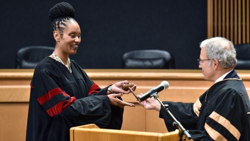 September 27, 2018 Lawrenceville - Gwinnett County State Court judge Ronda Colvin-Leary (left) receives a gavel from State Court Judge Joseph C. Iannazzone after she was sworn-in.