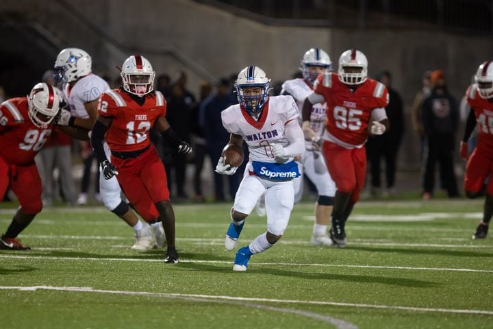 Walton's Sutton Smith (1) runs the ball during a GHSA high school football playoff game between the Archer Tigers and the Walton Raiders at Archer High School in Lawrenceville, GA., on Friday, November 19, 2021. (Photo/Jenn Finch)