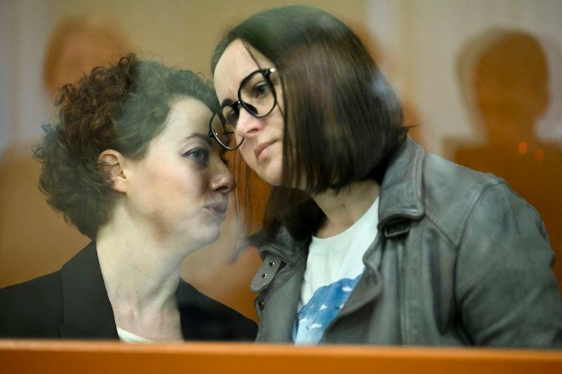 Theater director Zhenya Berkovich, left, and playwright Svetlana Petriychuk are seen in a glass cage prior to a hearing in a court in Moscow, Russia, Monday, May 20, 2024. Berkovich, a prominent independent theater director, and Petriychuk, a playwright have been behind bars since early May. Authorities claim a play they staged, "Finist, the Brave Falcon," justifies terrorism, which is a criminal offence in Russia punishable by up to seven years in prison. (AP Photo/Dmitry Serebryakov)