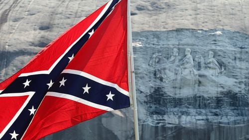 A Confederate flag waves at the base of the mountain after a pro-flag rally at Stone Mountain Park on Saturday, August 1, 2015, in Stone Mountain. Curtis Compton / ccompton@ajc.com