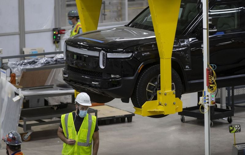 Electric vehicles are assembled and tested at the Rivian plant in Normal, Ill. Rivian is now searching for a site for a second factory in the U.S., and Georgia is planning a big push to land it. (Brian Cassella/Chicago Tribune/TNS)