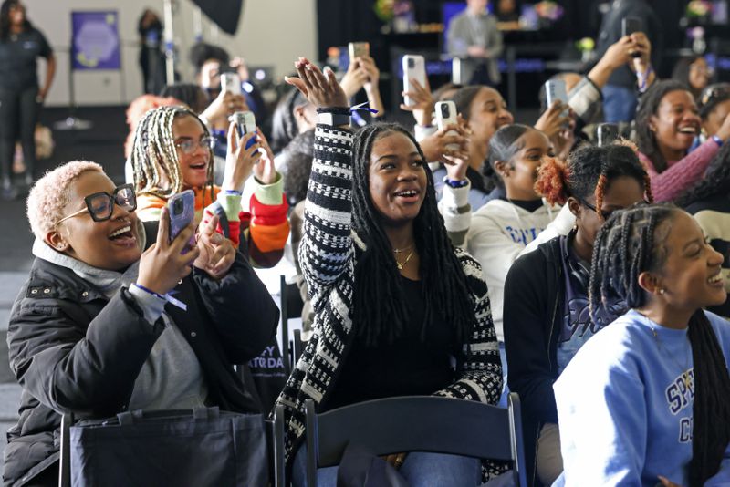 Spelman student Nyla Lovelock, center, and other Spelman students react as influencers Rickey Thompson and Denzel Dion exit the stage during Spelman Creator Day at the Wellness Center Gymnasium at Spelman College, Monday, March 20, 2023, in Atlanta. Creator Day is an audio event including influencers Rickey Thompson, Denzel Dion, and Wunmi Bello. Spelman is the first HBCU to partner with Spotify for its NextGen program. Jason Getz / Jason.Getz@ajc.com)
