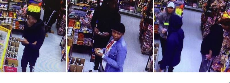 Left to right: The man in a black hoodie, the person in a black hat and the person in a white hat are accused of cashing in stolen lottery tickets Nov. 16 at an Exxon convenience store in the 3500 block of Lee Road. (Credit: Gwinnett County Police Department)