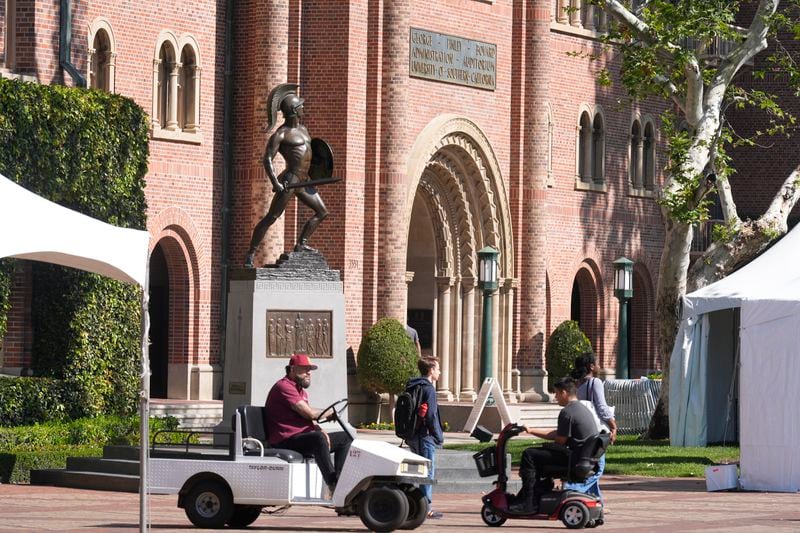 The iconic Tommy Trojan statue stands posed at the University of Southern California campus in Los Angeles Tuesday, April 16, 2024. University of Southern California officials have canceled a commencement speech by its 2024 valedictorian, a pro-Palestinian Muslim, citing "substantial risks relating to security and disruption" of the event that draws 65,000 people to campus. (AP Photo/Damian Dovarganes)
