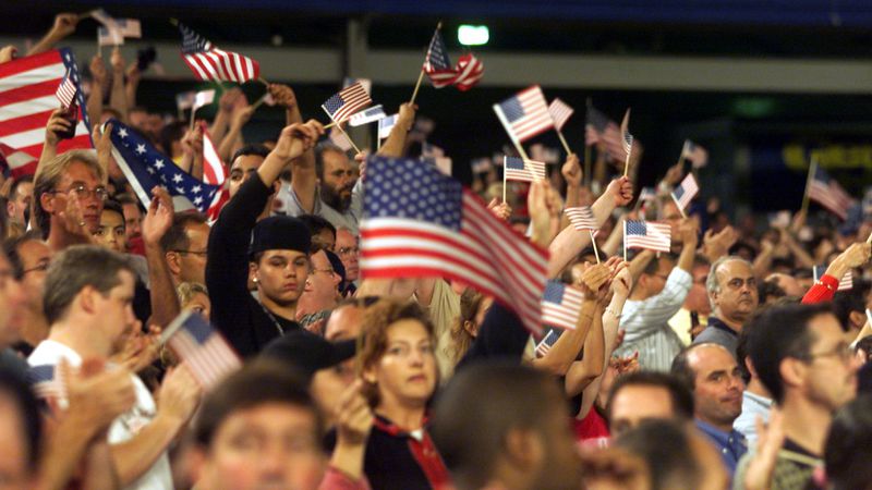 American flags fly from the stands at Shea Stadium for the Braves-Mets game Friday, Sept. 21, 2001. (Phil Skinner/AJC).