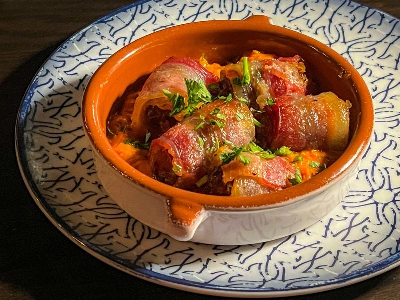 The bacon-wrapped dates at Silla del Toro are recommended. Henri Hollis/henri.hollis@ajc.com