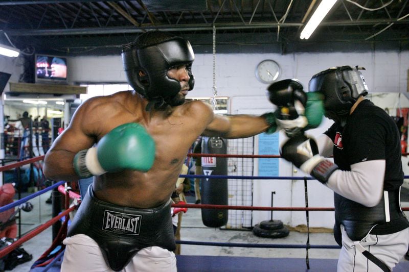 Former boxer O’Neil Bell (left) was shot and killed in 2015.