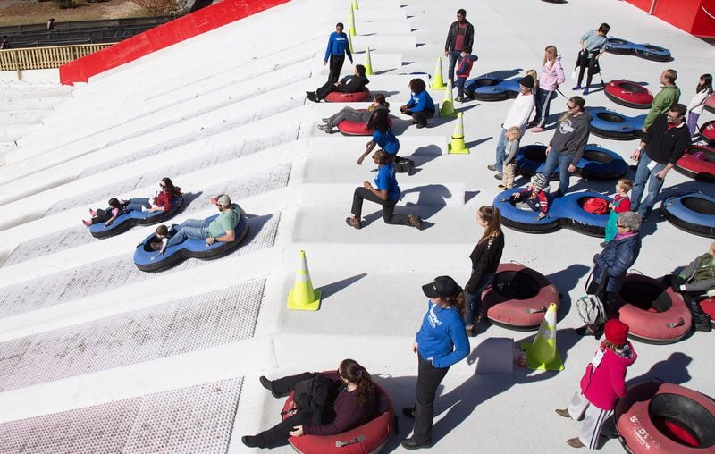 In this file photo, the 400-foot tubing hill is a big draw at Snow Mountain in Stone Mountain Park. STEVE SCHAEFER / SPECIAL TO THE AJC 2017