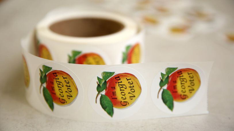 “I’m A Georgia Voter” stickers are shown during the Georgia runoff election voting at Henry W. Grady High School Tuesday, July 24, 2018, in Atlanta. (JASON GETZ/SPECIAL TO THE AJC)