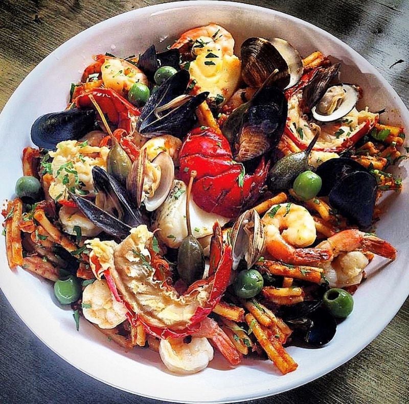 Warm Seafood Salad holds a medley of lobster, clams, mussels and shrimp. CONTRIBUTED BY ASHA GOMEZ