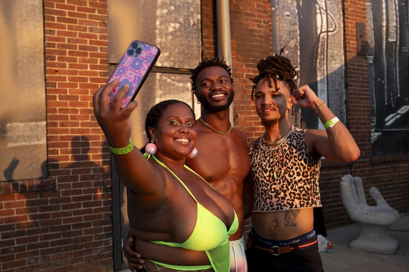 Brittney Jones, from left, Louis Ellos and Brian Smith take a photo at the Chaka Khan Hacienda party at Pullman Yards on Sunday, Sept. 10, 2023. Photo by Ben Gray 
ben@bengray.com