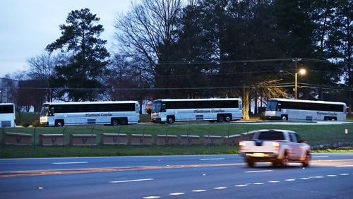 March 10, 2020 Marietta: A row of buses sit inside Dobbins Air Reserve Base off South Cobb Drive waiting on as many as 200 passengers from the Grand Princess cruise ship off the coast of California where more than 20 passengers have tested positive for a new strain of coronavirus on Tuesday, March 10, 2020, in Marietta. Curtis Compton ccompton@ajc.com