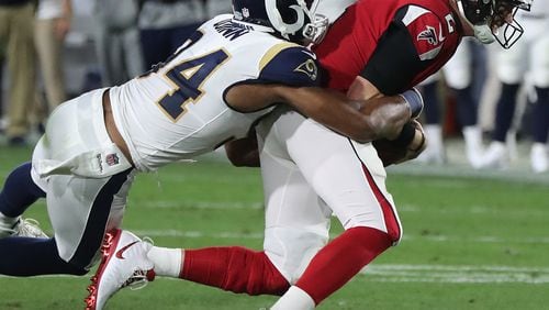 January 6, 2018 Los Angeles: Rams Robert Quinn tackles Matt Ryan on a quarterback keeper during the first quarter in their NFL Wild Card Game on Saturday, January 6, 2018, in Los Angeles.    Curtis Compton/ccompton@ajc.com