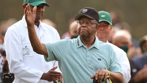 Lee Elder accepts the applause of the patrons during his introduction at the ceremonial tee shot to begin the Masters Thursday at Augusta National Golf Club.