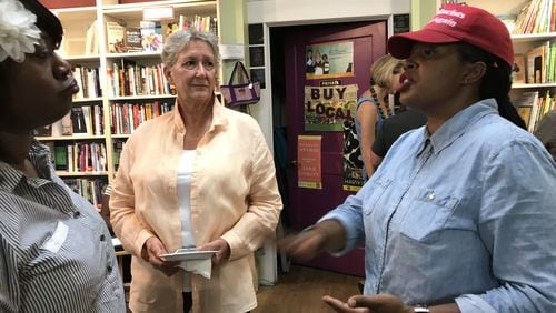 SONG co-director Mary Hooks (far rights) talks with Jessica Sykes, of the Motherless Village of Hope, and Anna Daane of the United Way of Greater Atlanta, about the “Black Mama Bailout” during a fundraiser at Charis Books & More. CREDIT: SHELIA M. POOLE