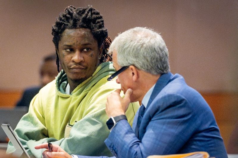 Atlanta rapper Young Thug talks to defense attorney Brian Steel during jury selection in the “Young Slime Life” gang case at the Fulton County Courthouse Tuesday, September 12, 2023.  (Steve Schaefer/steve.schaefer@ajc.com)
