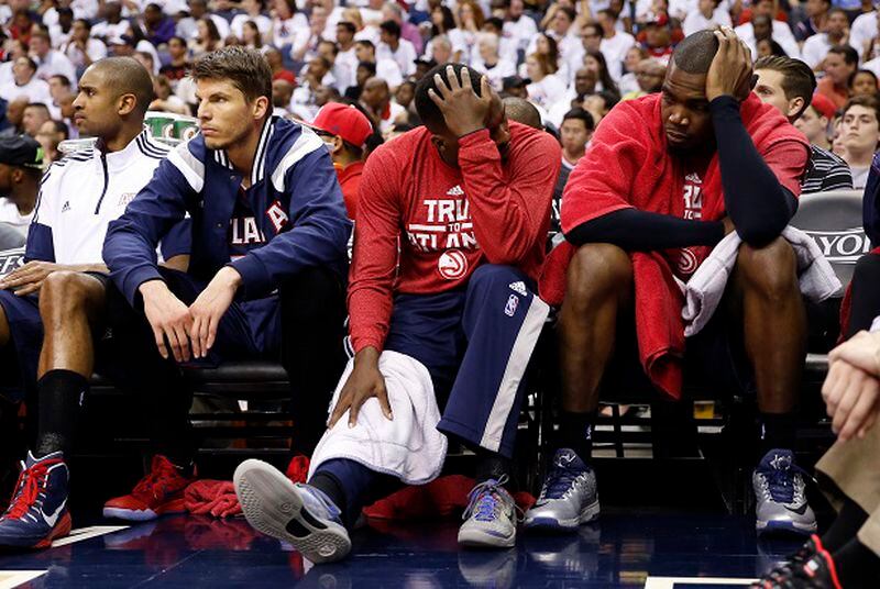 Not exactly the fun bunch. (Alex Brandon/AP photo) Atlanta Hawks guard Kyle Korver, second from left, guard Shelvin Mack (8) and forward Paul Millsap sit on the bench in the second half of Game 3 of the second round of the NBA basketball playoffs against the Washington Wizards, Saturday, May 9, 2015, in Washington. The Wizards won 103-101. (AP Photo/Alex Brandon)