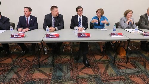 April 12, 2017, Marietta: Candidates Matt Campbell (from left), Royden Roy Daniels, Exton Howard, Gus Makris, Kay Kirkpatrick, Christine Triebsch, and Bob Wiskind participate in a debate for the open state Senate seat that was held by Judson Hill at the East Cobb Library on Wednesday in Marietta. Curtis Compton/ccompton@ajc.com