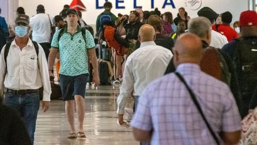 Passengers make their way through Concourse A at Hartsfield-Jackson Atlanta International Airport on Wednesday, June 22, 2022. Steve Schaefer / steve.schaefer@ajc.com)