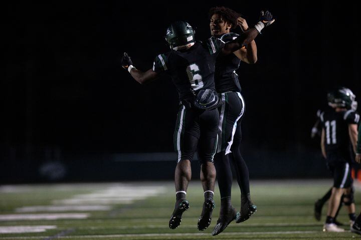 Collins Hill's Spenser Anderson (6) and Ethan Davis (9) celebrate during a GHSA high school football game between the Collins Hill Eagles and the Grayson Rams at Collins Hill High in Suwanee, GA., on Friday, December 3, 2021. (Photo/ Jenn Finch)