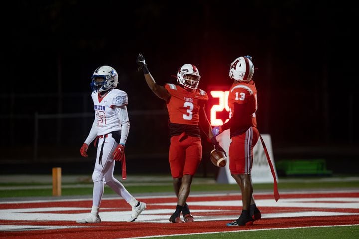 Archer's Derrick Moore II (3) and Al Edwards (13) celebrate a touchdown during a GHSA high school football playoff game between the Archer Tigers and the Walton Raiders at Archer High School in Lawrenceville, GA., on Friday, November 19, 2021. (Photo/Jenn Finch)