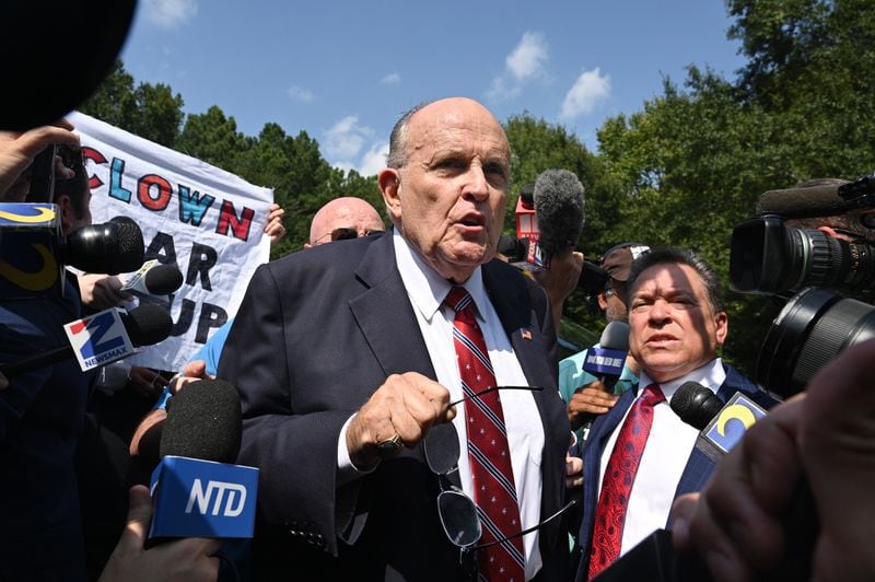 Rudy Giuliani speaks to members of the press outside the Fulton County Jail after being booked and released, Wednesday, August 23, 2023, in Atlanta. (Hyosub Shin / Hyosub.Shin@ajc.com)