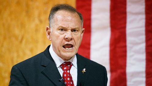In this Nov. 30, 2017 file photo, former Alabama Chief Justice and U.S. Senate candidate Roy Moore speaks at a campaign rally, in Dora, Ala. Most statewide Republican officeholders in Alabama say they're voting for Moore for U.S. Senate, but the state's senior U.S. Sen. Richard Shelby didn't vote for Moore. Polls show Moore in a tight race with Democrat Doug Jones.