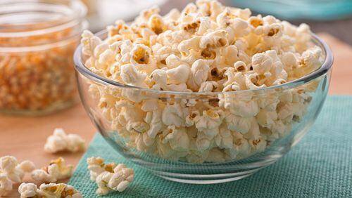 Popcorn. Pour about a quarter-cup into a brown paper bag. Squeeze out the air and seal by rolling the top of the bag down a few inches. Microwave on high for two minutes. Add salt and butter if you’d like. (Dreamstime/TNS)