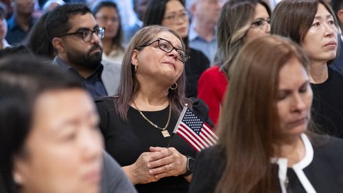 Dina Pimentel, from Argentina, can’t hold back her emotions after she was sworn in as a naturalized citizen during a ceremony at The Carter Center in Atlanta on Sunday, Oct. 1, 2023. The ceremony was held at the center in honor of President Jimmy Carter’s 99th birthday.   (Ben Gray / Ben@BenGray.com)