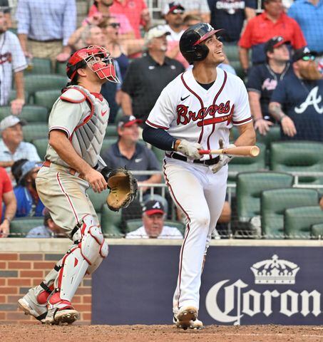 Atlanta Braves' Matt Olson hits a three-run homer during the ninth inning of game one of the baseball playoff series between the Braves and the Phillies at Truist Park in Atlanta on Tuesday, October 11, 2022. (Hyosub Shin / Hyosub.Shin@ajc.com)