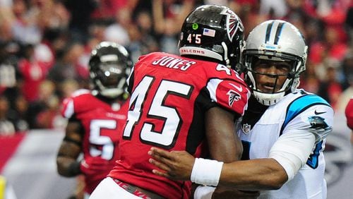 Panthers quarterback Cam Newton is hit by Falcons linebacker Deion Jones Oct. 2, 2016, at the Georgia Dome in Atlanta. The hit resulted in a concussion for Newton.