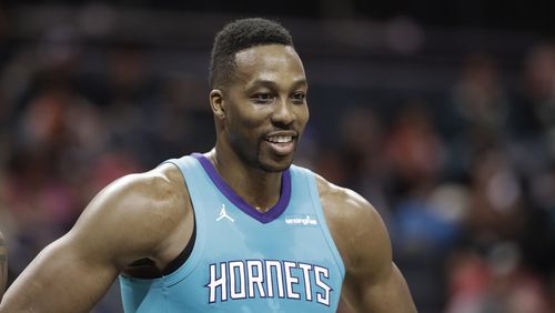 Charlotte Hornets' Dwight Howard smiles during a stop in play during the second half of an NBA basketball game against the Brooklyn Nets in Charlotte, N.C., Thursday, March 8, 2018. (AP Photo/Chuck Burton)
