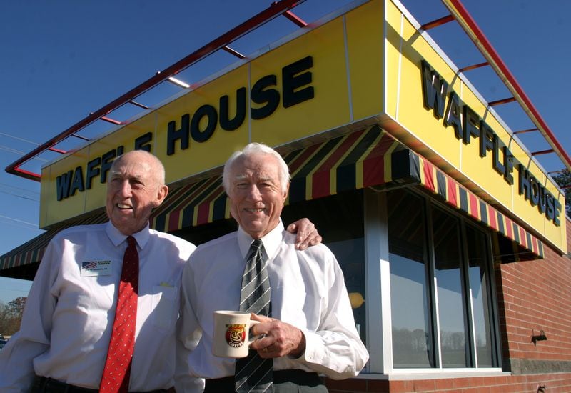041216 - DULUTH, GA -- (left to right) Joe Rogers, Sr. and Tom Forkner started the Waffle House chain 50 years ago in Avondale Estates. Rogers and Forkner pose outside a fairly new Waffle House off Old Peachtree Rd. and I-85 in Duluth on Thursday, December 16, 2004.. (JESSICA MCGOWAN/Special)