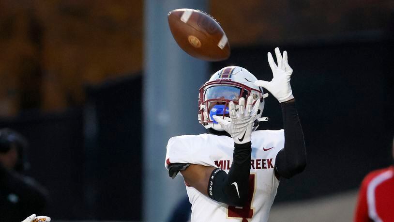 Mill Creek wide receiver Makhail Wood (4) catches his second touchdown against Milton during the first half of their Class 7A semi-final at Lakewood Stadium, Friday, December 2, 2022, in Atlanta. Jason Getz / Jason.Getz@ajc.com)