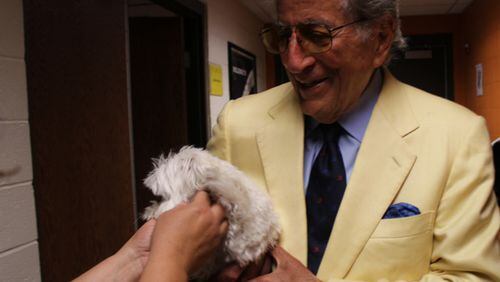 After the concert, Tony Bennett introduces his beloved dog, Happy, to fans (and my cousin Lorraine's arm). Photo: Melissa Ruggieri/AJC