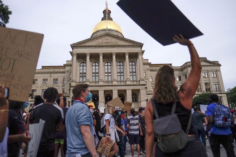 Protesters gather for a moment of silence at the Capitol on Sunday, June 7, 2020.  (Photo: Ben Gray for The Atlanta Journal-Constitution)
