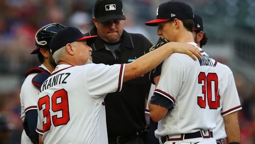 051022 Atlanta: Atlanta Braves pitching coach Rick Kranitz confers with starting pitcher Kyle Wright against the Boston Red Sox during the second inning of a MLB baseball game on Tuesday, May 10, 2022, in Atlanta.    “Curtis Compton / Curtis.Compton@ajc.com”