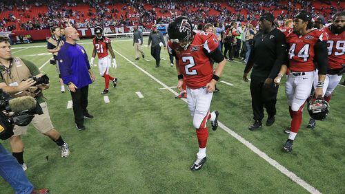 Falcons quarterback Matt Ryan appears to be bowing his head in shame as he heads to the locker room after a 20-10 loss to Minnesota at the Georgia Dome Sunday. (Curtis Compton/ccompton@ajc.com)