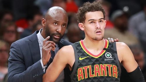 Hawks head coach Lloyd Pierce confers with Trae Young during a 123-110 victory over the Phoenix Suns Tuesday, Jan. 14, 2020, in Atlanta. (Curtis Compton ccompton@ajc.com)
